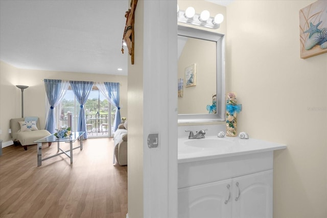 bathroom featuring wood-type flooring and vanity