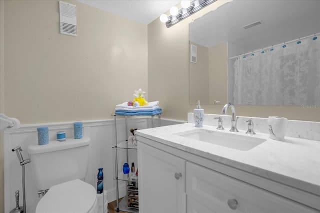 bathroom with vanity and toilet