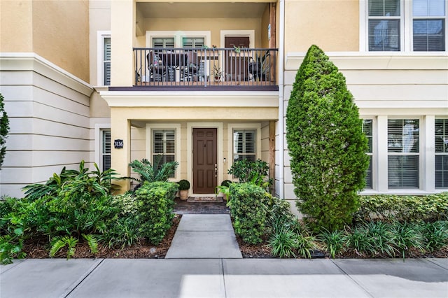 doorway to property featuring a balcony