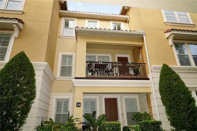 doorway to property featuring a balcony