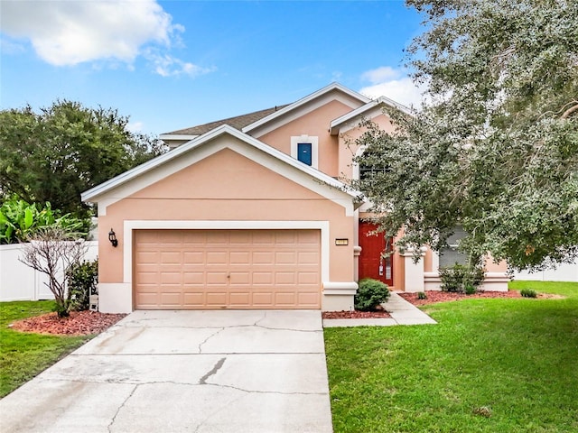 view of front of home with a garage and a front yard