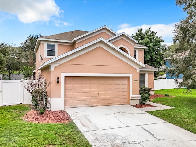 front facade featuring a garage and a front yard