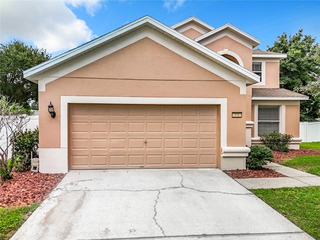 view of front of property featuring a garage