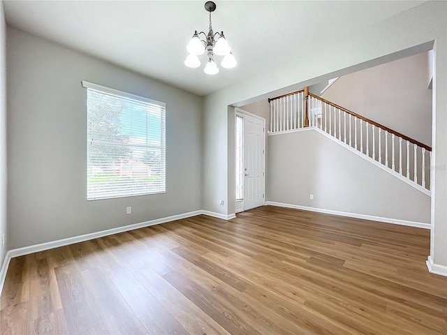 interior space featuring an inviting chandelier and hardwood / wood-style floors