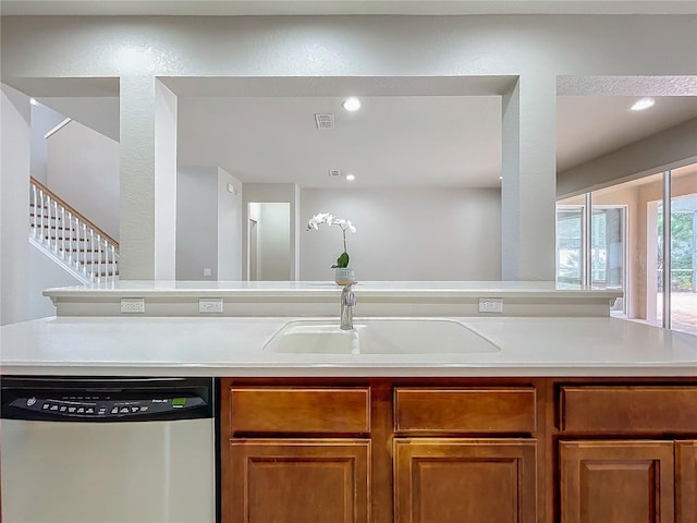 kitchen featuring stainless steel dishwasher and sink