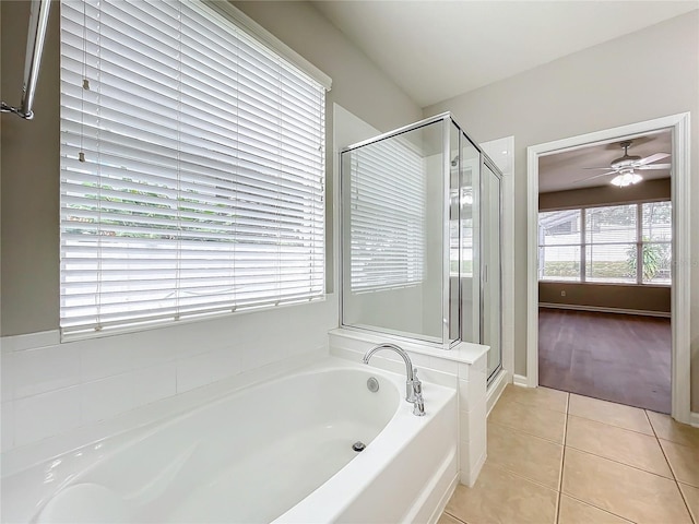 bathroom featuring ceiling fan, tile patterned floors, and plus walk in shower