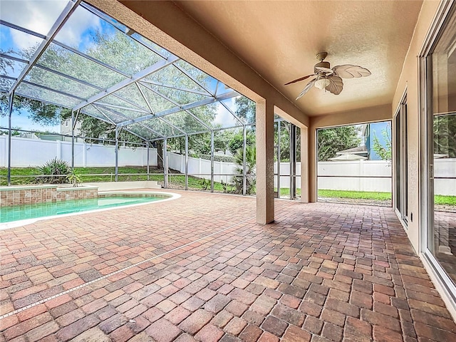 view of patio featuring a fenced in pool, a lanai, and ceiling fan