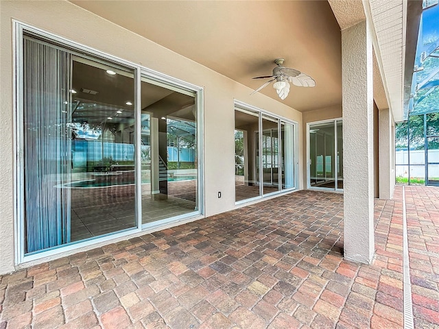 view of patio / terrace featuring ceiling fan