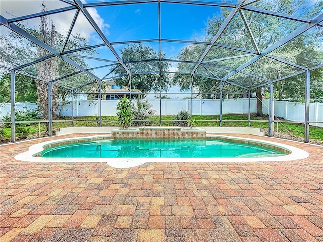 view of pool with a lanai and a patio area