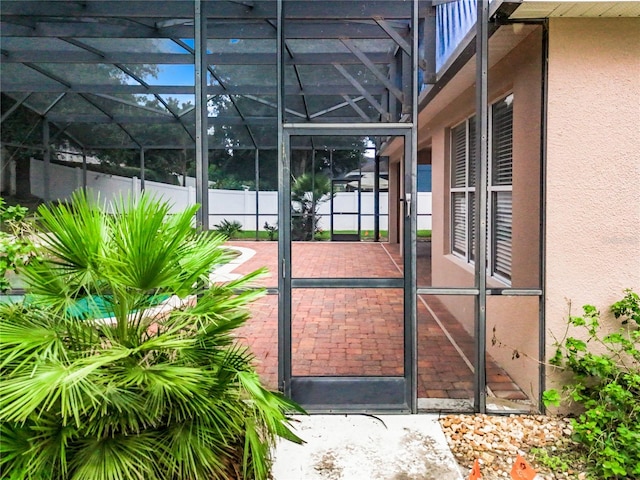 view of gate with glass enclosure