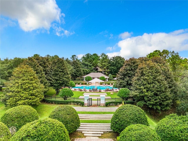 view of home's community featuring a swimming pool