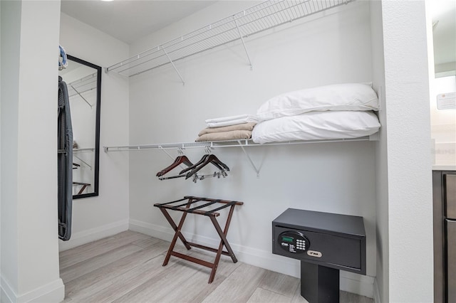 spacious closet featuring light hardwood / wood-style floors