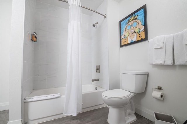 bathroom featuring toilet, hardwood / wood-style flooring, and shower / tub combo