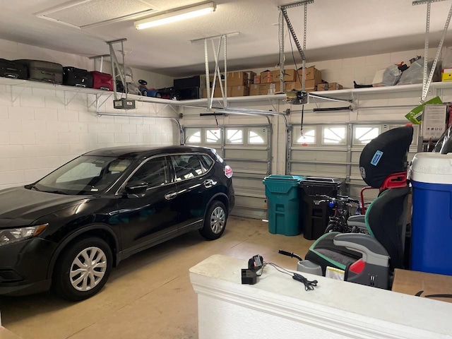 garage featuring a garage door opener