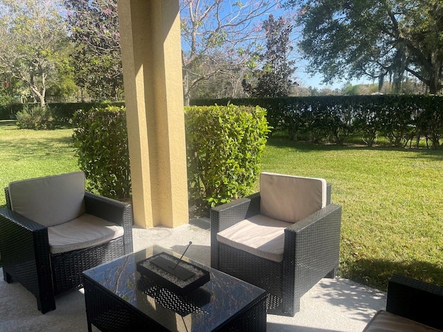 view of patio / terrace with an outdoor living space and a fenced backyard