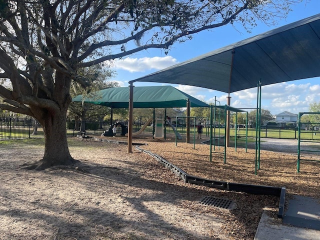 community jungle gym featuring fence