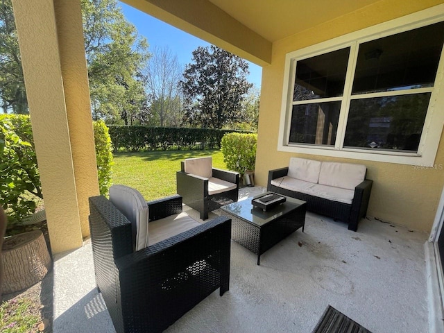 view of patio featuring an outdoor hangout area and a fenced backyard