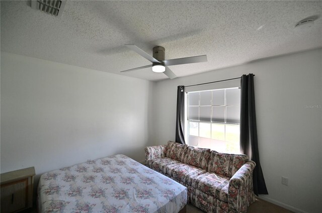 bedroom featuring a textured ceiling and ceiling fan