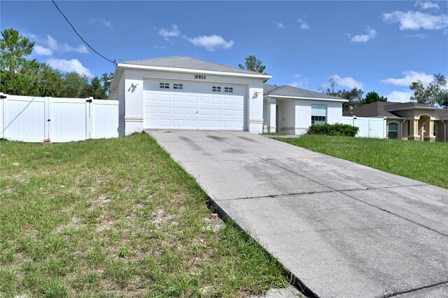 view of front of house featuring a garage and a front yard