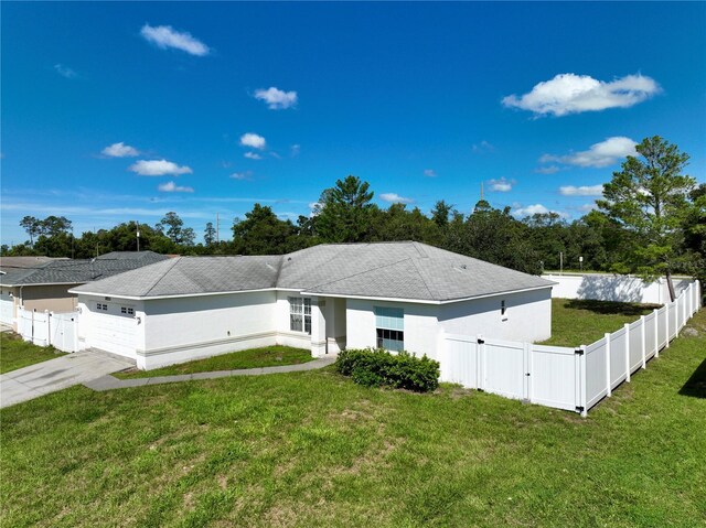 single story home with a front lawn and a garage