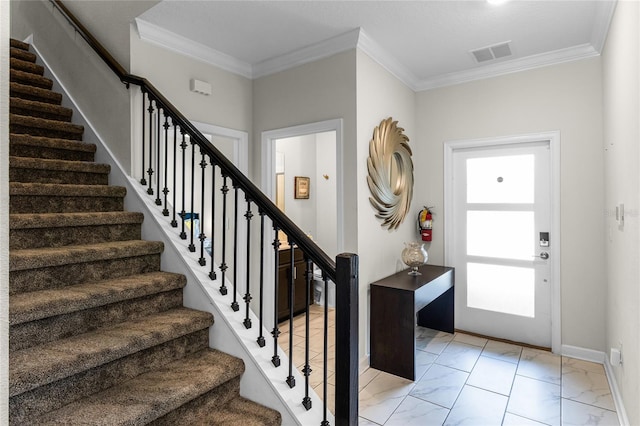 entrance foyer featuring crown molding