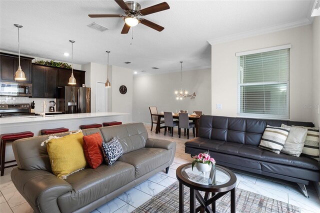 1224 Challenge Dr, Davenport, FL 33896 - living room featuring visible vents, ceiling fan with notable chandelier, marble finish floor, ornamental molding, and recessed lighting
