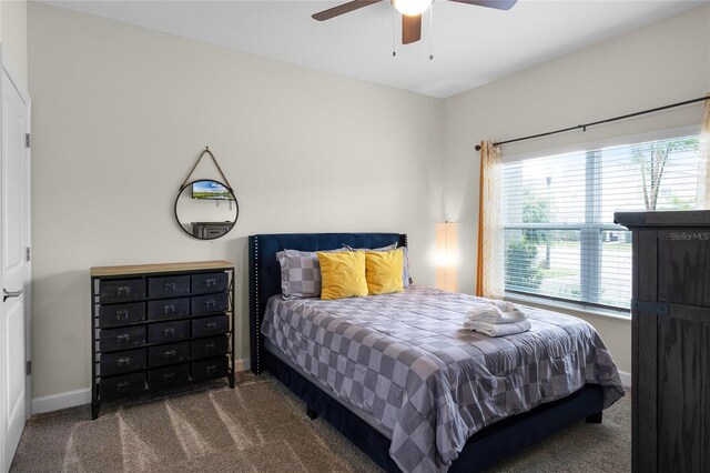 1224 Challenge Dr, Davenport, FL 33896 - bedroom with carpet floors, baseboards, and a ceiling fan