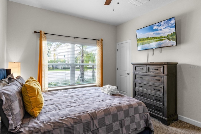 bedroom with ceiling fan and carpet floors