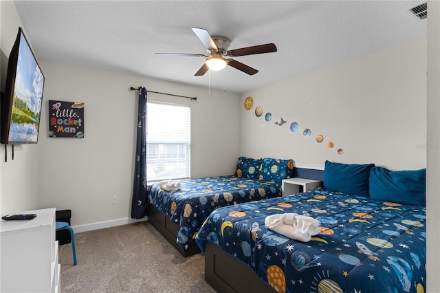 1224 Challenge Dr, Davenport, FL 33896 - carpeted bedroom featuring baseboards, a ceiling fan, a textured ceiling, and visible vents