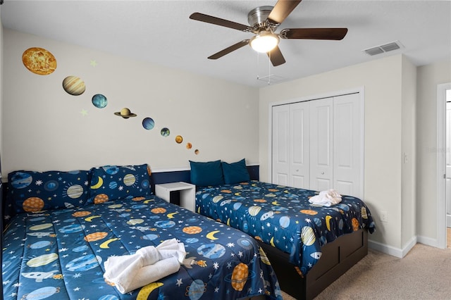 bedroom with carpet flooring, a closet, and ceiling fan