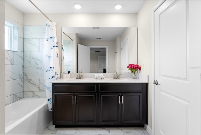 bathroom with vanity and shower / bath combination with curtain