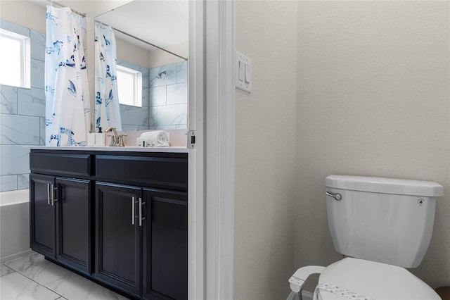 full bathroom featuring vanity, toilet, and shower / bathtub combination with curtain