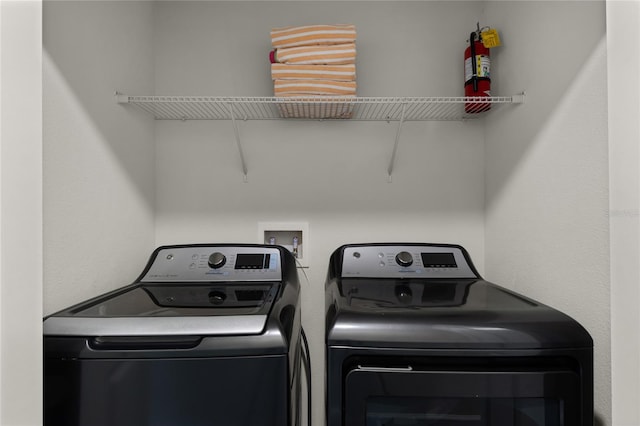 laundry area featuring washing machine and clothes dryer