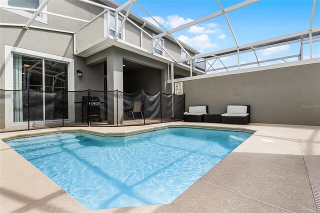 1224 Challenge Dr, Davenport, FL 33896 - view of swimming pool featuring a fenced in pool, a lanai, grilling area, and a patio area