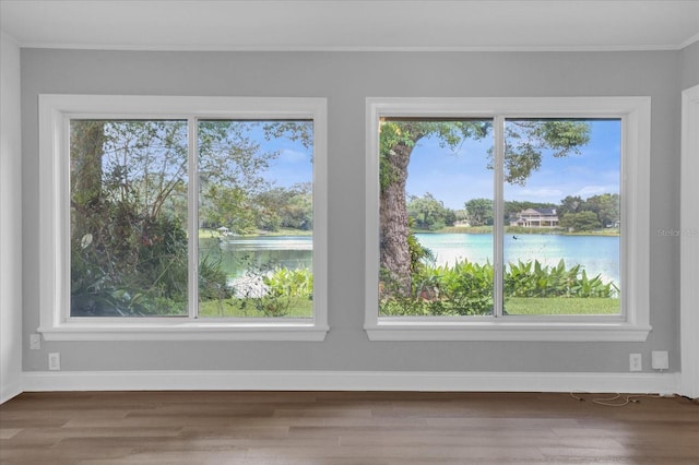 interior space featuring a healthy amount of sunlight and a water view