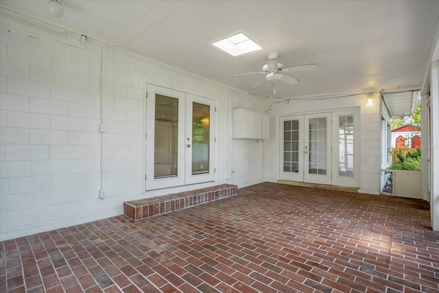 view of patio / terrace featuring ceiling fan and french doors