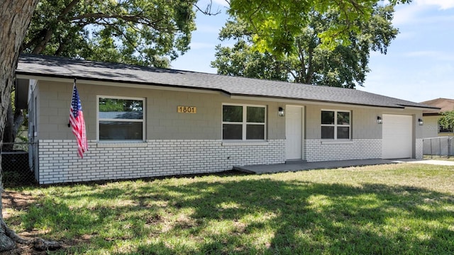 exterior space featuring a yard and a garage