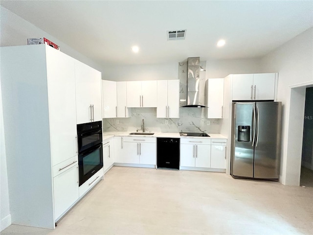 kitchen featuring wall chimney exhaust hood, black appliances, backsplash, sink, and white cabinetry