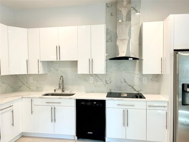 kitchen featuring white cabinetry, black appliances, sink, light stone countertops, and wall chimney exhaust hood