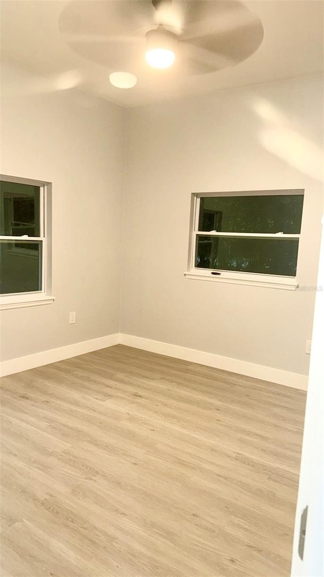 unfurnished room featuring ceiling fan and light hardwood / wood-style floors