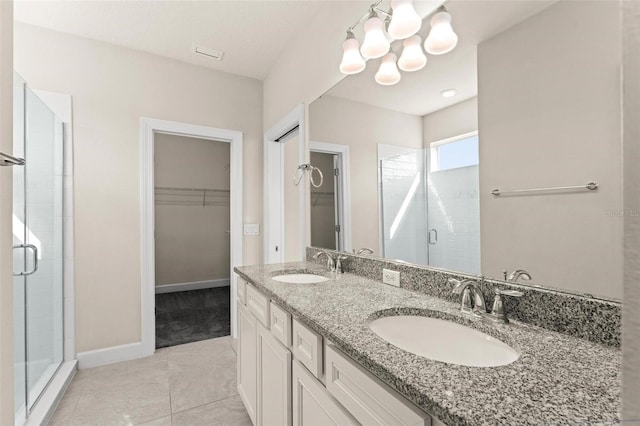 bathroom with vanity, walk in shower, and tile patterned flooring