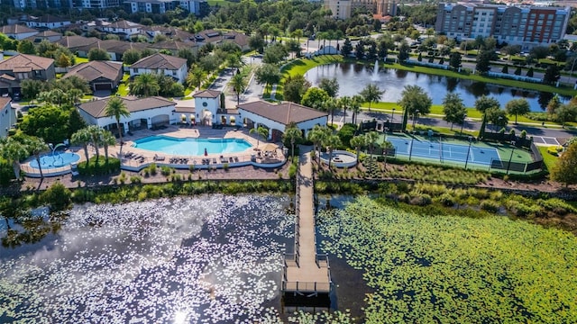 birds eye view of property with a water view