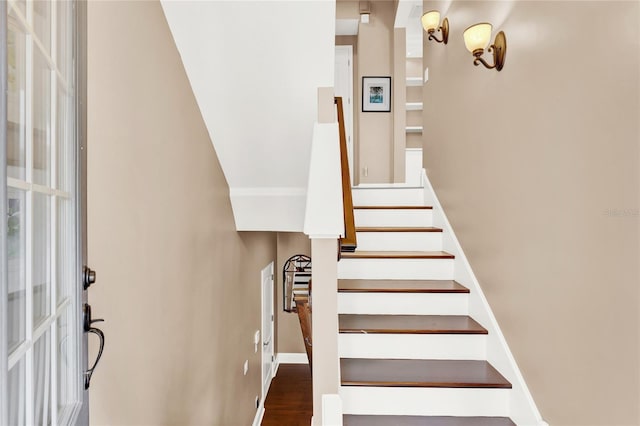 stairway featuring wood-type flooring