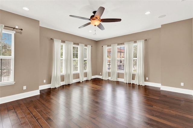 unfurnished room with dark wood-type flooring and ceiling fan