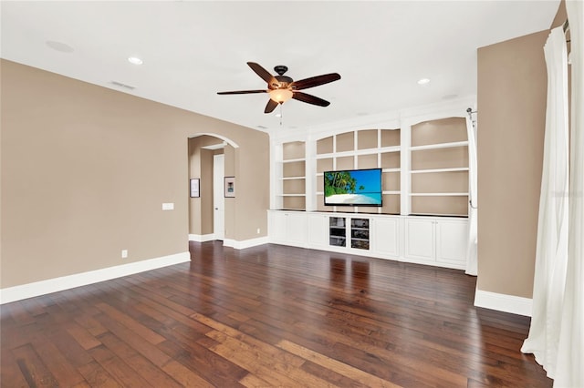 unfurnished living room featuring dark hardwood / wood-style flooring and ceiling fan