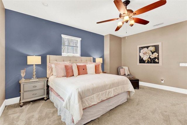 bedroom with light carpet and ceiling fan