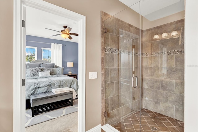 bathroom featuring a shower with door and ceiling fan