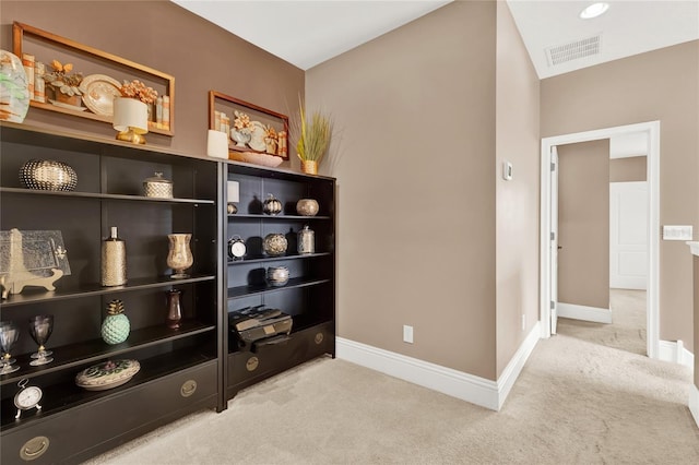 interior space featuring light colored carpet