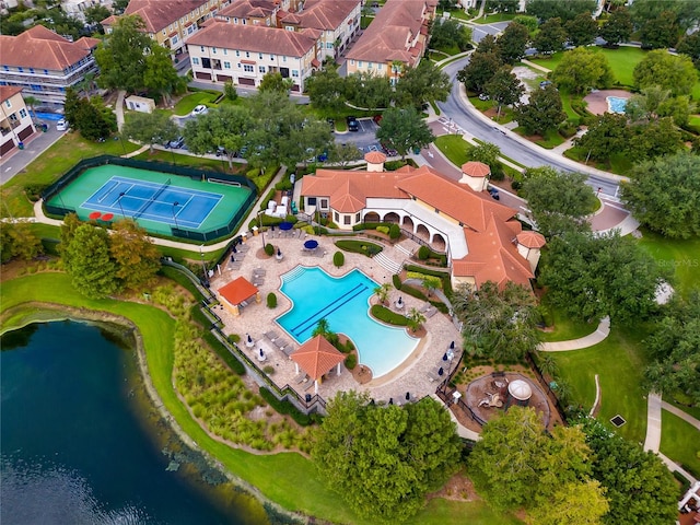 birds eye view of property with a water view