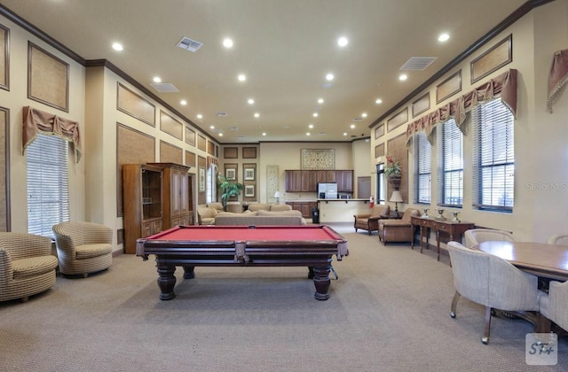 playroom featuring billiards, plenty of natural light, ornamental molding, and light colored carpet